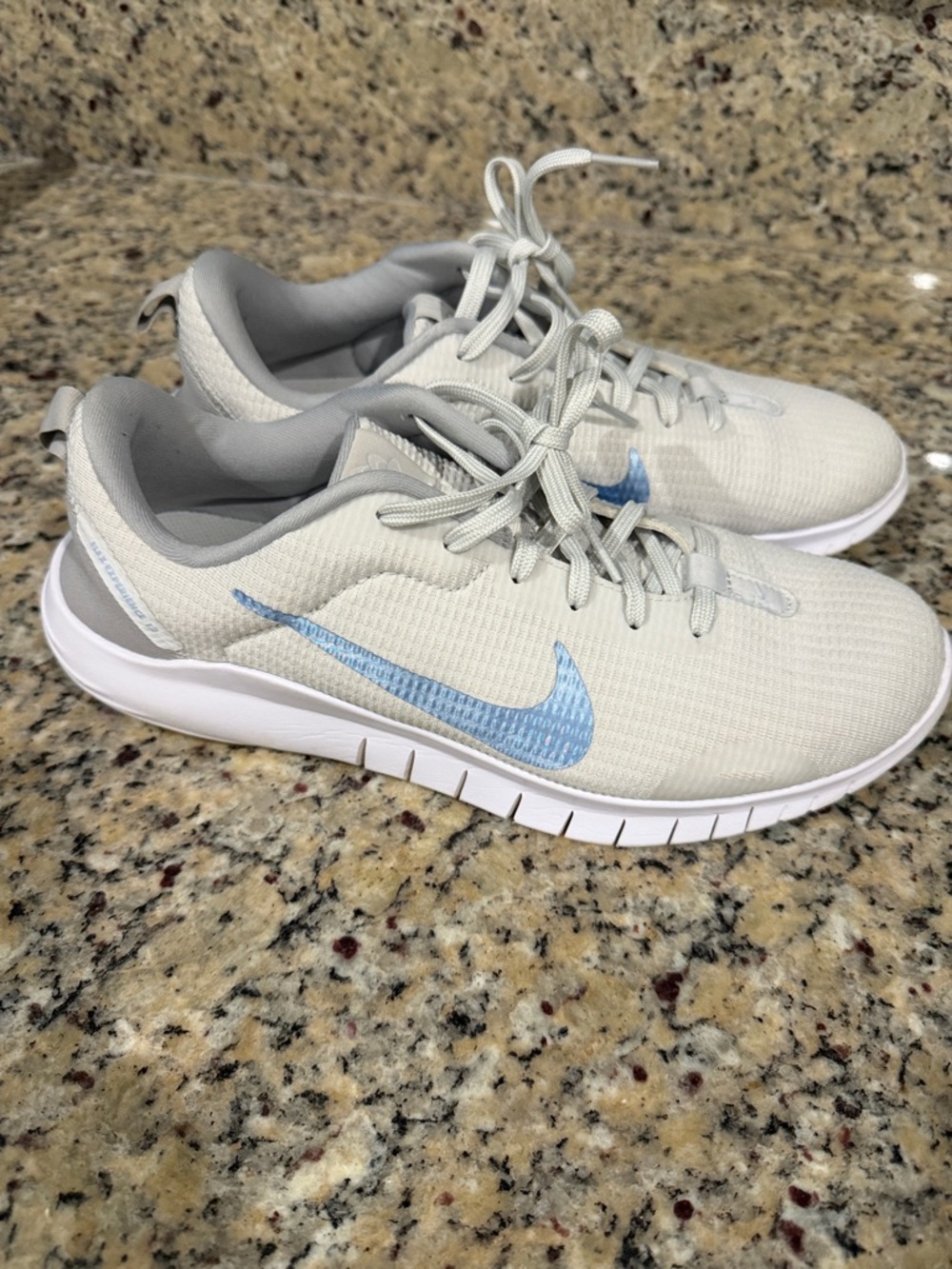 Nike Light Gray Sneakers with Blue Swoosh